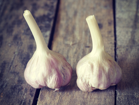 garlic on wood retro-vintage styleの写真素材