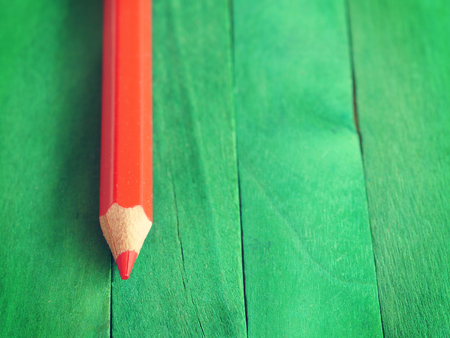 Red Pencil on Green Background old retro vintage styleの写真素材