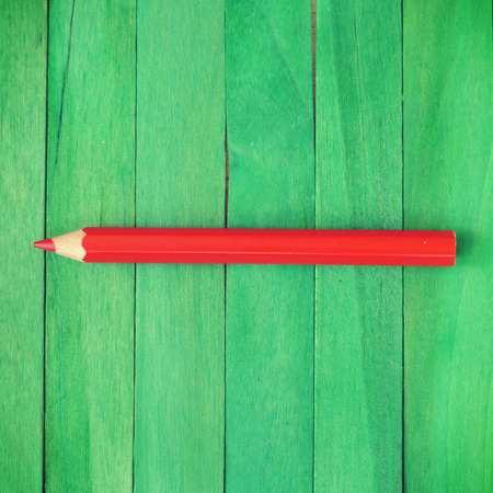 Red Pencil on Green Background old retro vintage styleの写真素材
