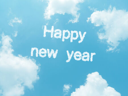 happy new year cloud words with design on blue sky backgroundの写真素材
