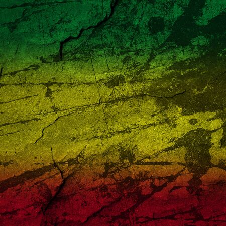 Red, yellow, green rasta flag on stone wallの写真素材