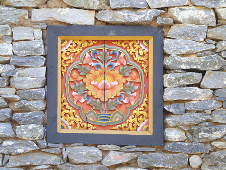 ancient bhutan style windows on stone walla