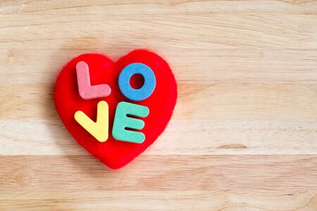 Valentines Day background red heart on wooden backgroundの写真素材