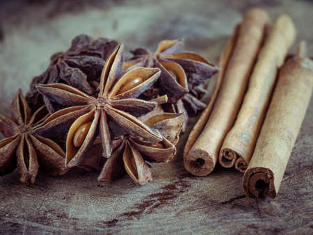 cinnamon sticks and star anise on  wood backgroundの写真素材