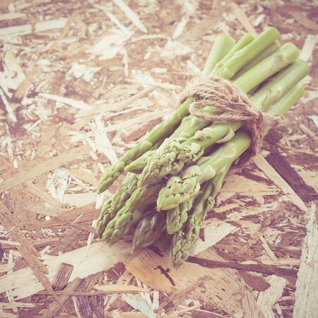 asparagus on wooden table with filter effect retro vintage styleの写真素材