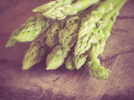 asparagus on wooden table with filter effect retro vintage styleの写真素材