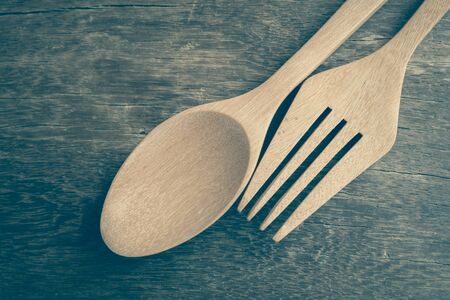 Wooden spoon  on wood table with filter effect retro vintage styleの写真素材