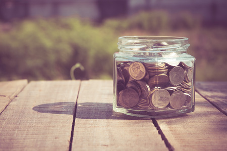 money in the glass with filter effect retro vintage styleの写真素材