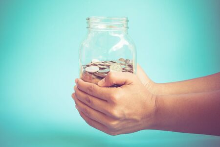 Hands holding money  with filter effect retro vintage style