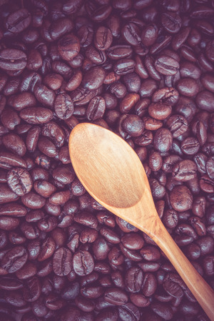 Coffee beans and wooden spoon with filter effect retro vintage styleの写真素材