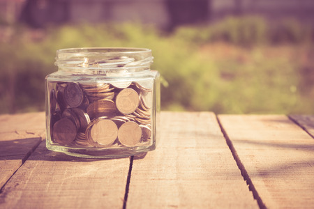 money in the glass with filter effect retro vintage styleの写真素材