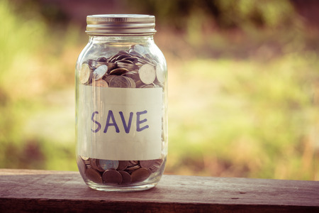 money in the glass with filter effect retro vintage styleの写真素材