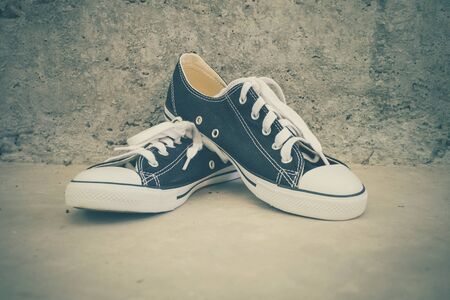 black sneakers with filter effect retro vintage styleの写真素材