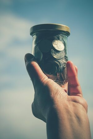 Hands holding money with filter effect retro vintage style