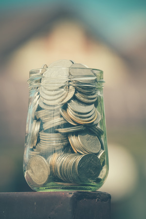 money in the glass with filter effect retro vintage styleの写真素材