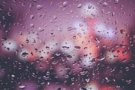 Drops of rain on glass with filter effect retro vintage styleの写真素材