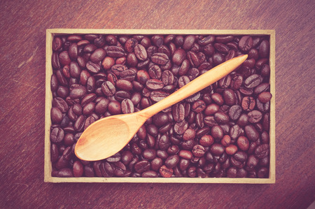 Coffee beans and wooden spoon with filter effect retro vintage styleの写真素材