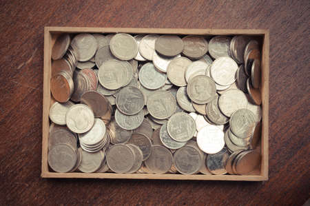 coins on wood with filter effect retro vintage style