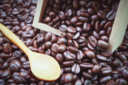 Coffee beans and wooden spoon with filter effect retro vintage styleの写真素材
