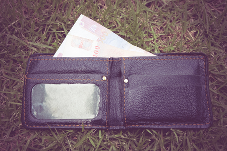 Money in leather wallet with filter effect retro vintage styleの写真素材