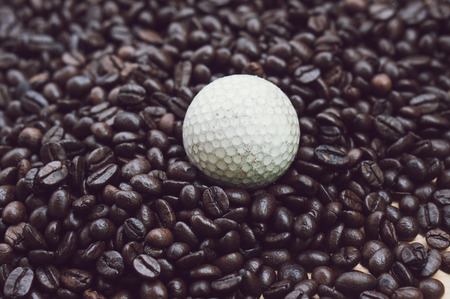 coffee beans and a old golfball with filter effect retro vintage style