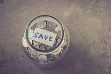 money in the glass with filter effect retro vintage styleの写真素材