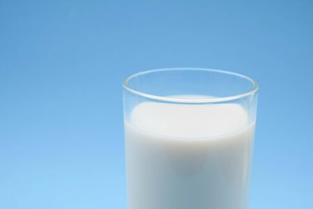 with milk on blue backgroundの写真素材