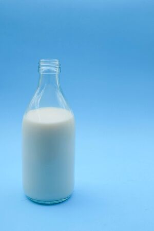with milk on blue backgroundの写真素材