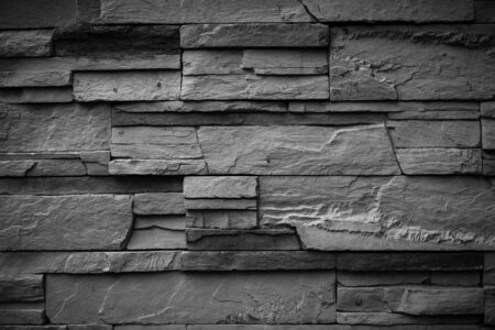 Black wall stone backgroundの写真素材