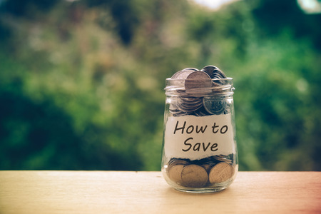 save money for investment concept money in the glass with filter effect retro vintage styleの写真素材