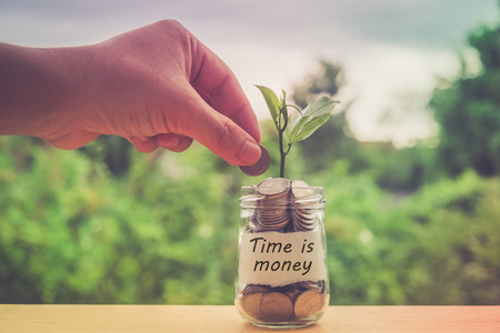 save money for investment concept money in the glass with filter effect retro vintage styleの写真素材