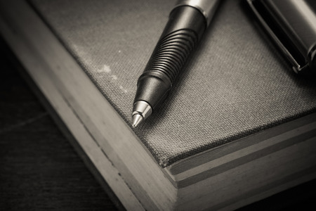 pen and book with filter effect retro vintage styleの写真素材