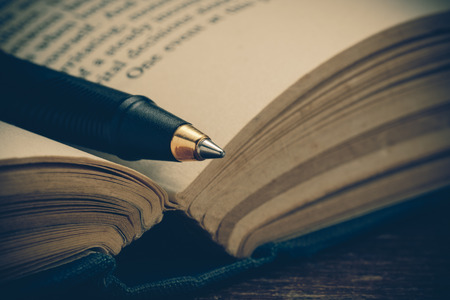 pen and book with filter effect retro vintage styleの写真素材