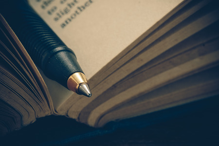 pen and book with filter effect retro vintage styleの写真素材