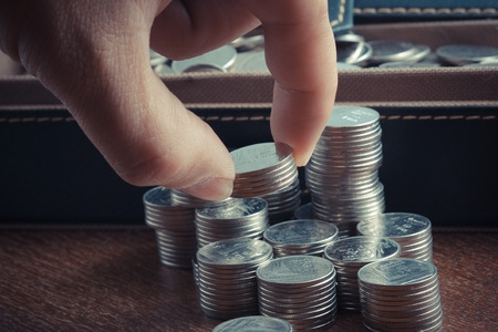 money concept coins baht thai and hand with filter effect retro vintage style
