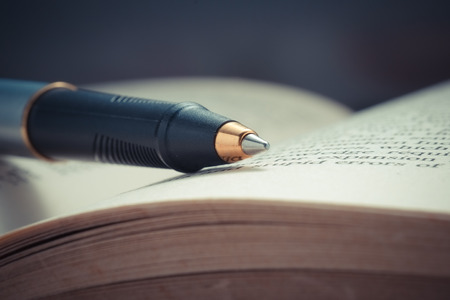 pen and book with filter effect retro vintage style