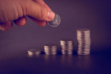 money concept coins baht thai and hand with filter effect retro vintage style