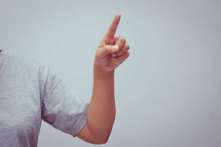 concept of forefinger pressing with filter effect retro vintage styleの写真素材