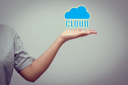 hand with cloud concept with filter effect retro vintage styleの写真素材