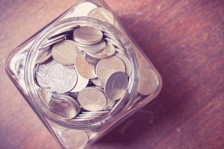 save money for investment concept money in the glass with filter effect retro vintage styl