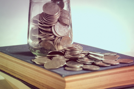 save money for investment concept money in the glass with filter effect retro vintage styleの写真素材