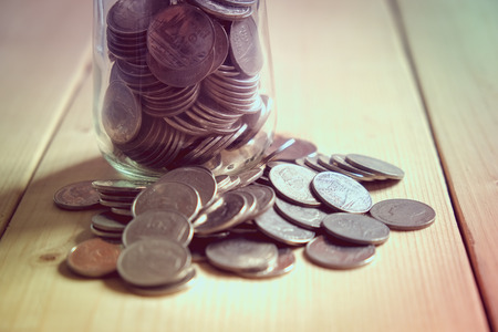 save money for investment concept money in the glass with filter effect retro vintage style