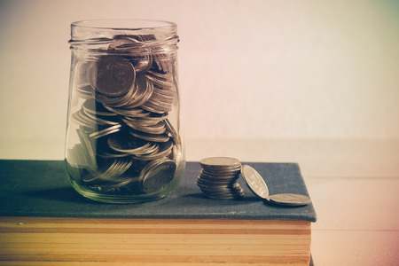 save money for investment concept money in the glass with filter effect retro vintage styleの写真素材