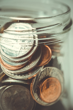 business finance. save money for investment concept money in the glass with filter effect retro...