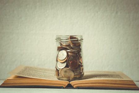 business finance. save money for investment concept money in the glass with filter effect retro vintage styleの写真素材