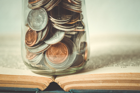 business finance. save money for investment concept money in the glass with filter effect retro vintage styleの写真素材