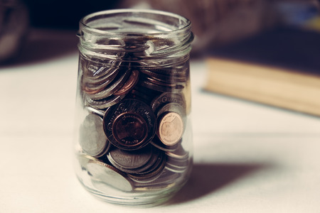 business finance. save money for investment concept money in the glass with filter effect retro vintage styleの写真素材