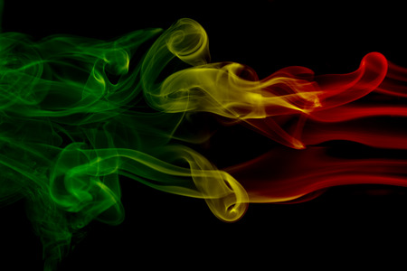 Smoke background reggae colors green, yellow, red colored in flag of reggae musicの写真素材