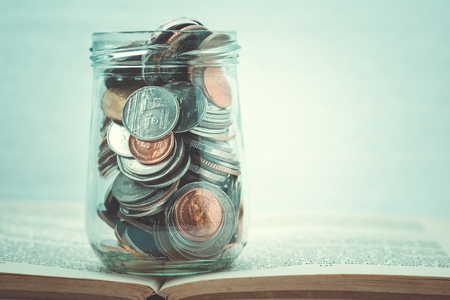 business finance. save money for investment concept money in the glass with filter effect retro vintage styleの写真素材