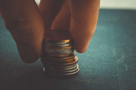 save money for investment concept Hands holding money with filter effect retro vintage styleの写真素材